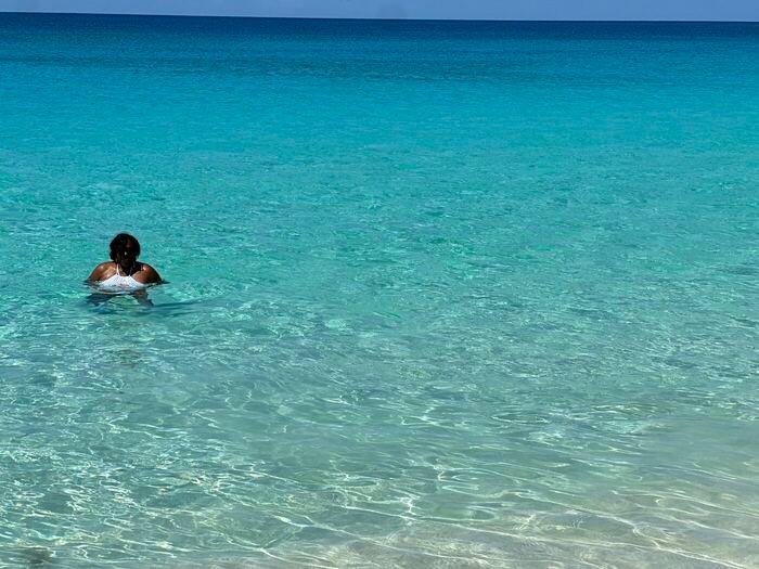 Traveler in clear Caribbean water