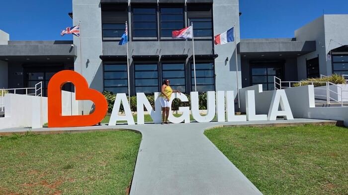 Traveler at the I Love Anguilla sign