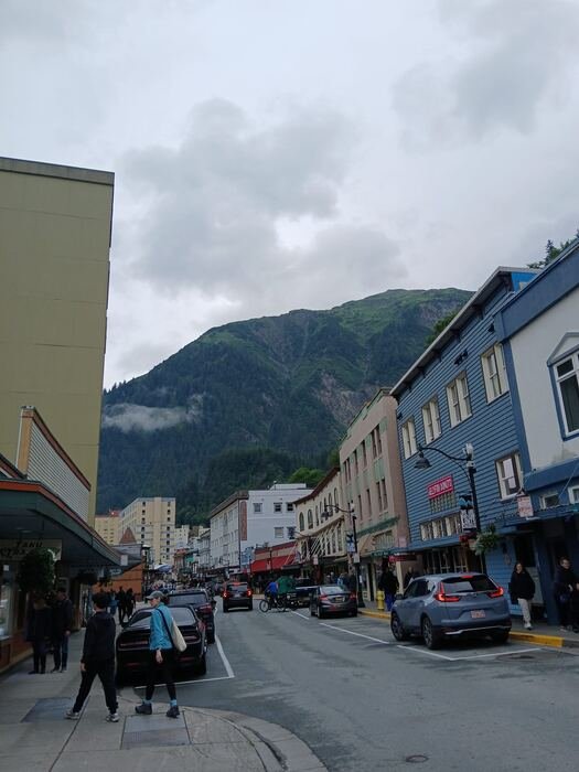 Downtown Juneau, Alaska street with mountain backdrop
